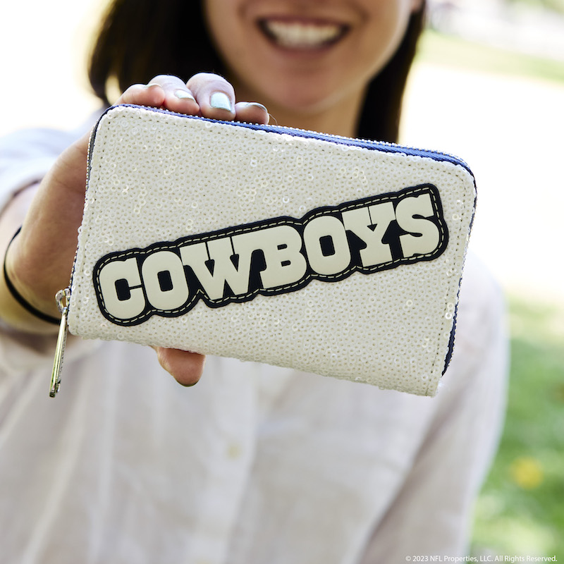 Image of woman holding out the NFL Dallas Cowboys Sequin Wallet out to camera
